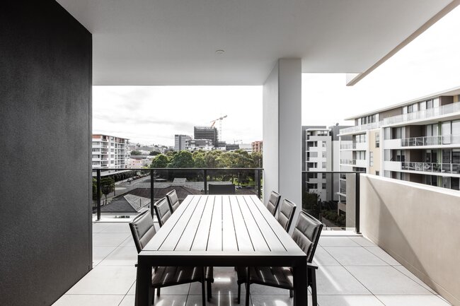Garden furniture and dining area on a modern balcony in