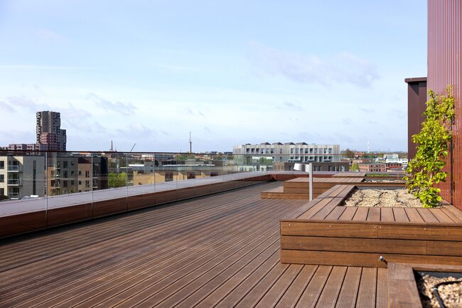 Multi-level rooftop terrace in Scandinavian style with a view