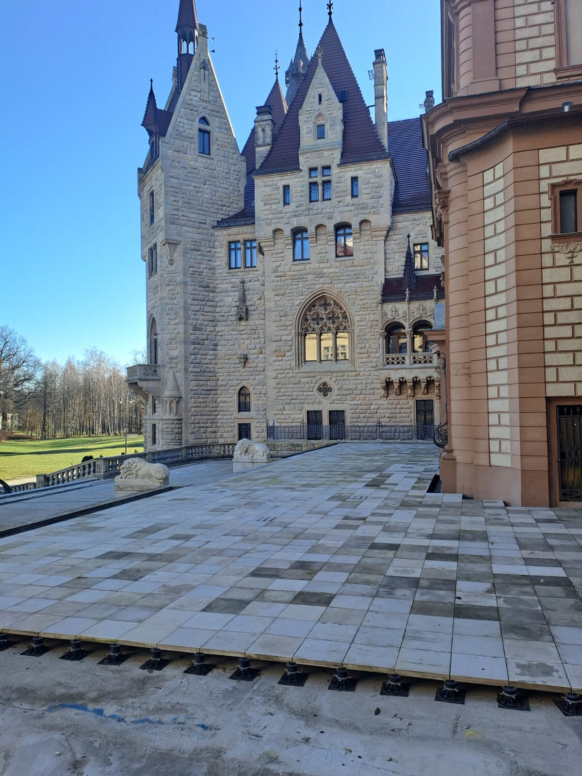 Construction of a raised deck terrace at the facade of Moszna Castle