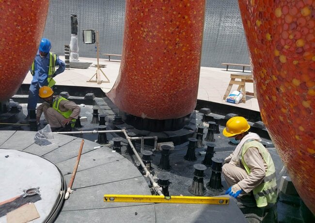 Leveling the leveling lath by a worker during installation