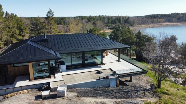 Terrace with pavers in a modern house by the water in Finland