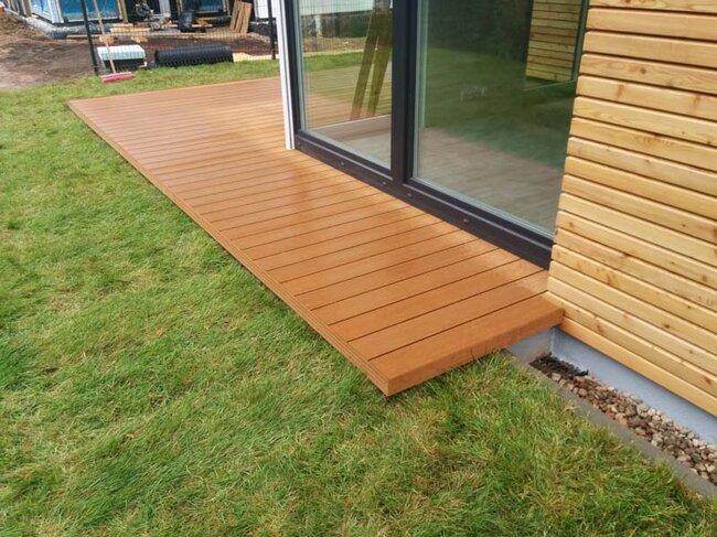 Composite terrace on the ground on pedestals, home terrace on the lawn