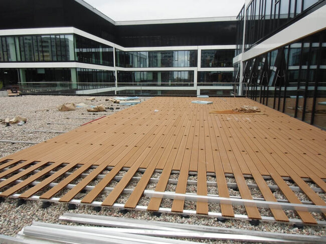 Installation of a raised deck terrace on solver pedestals in a usable space