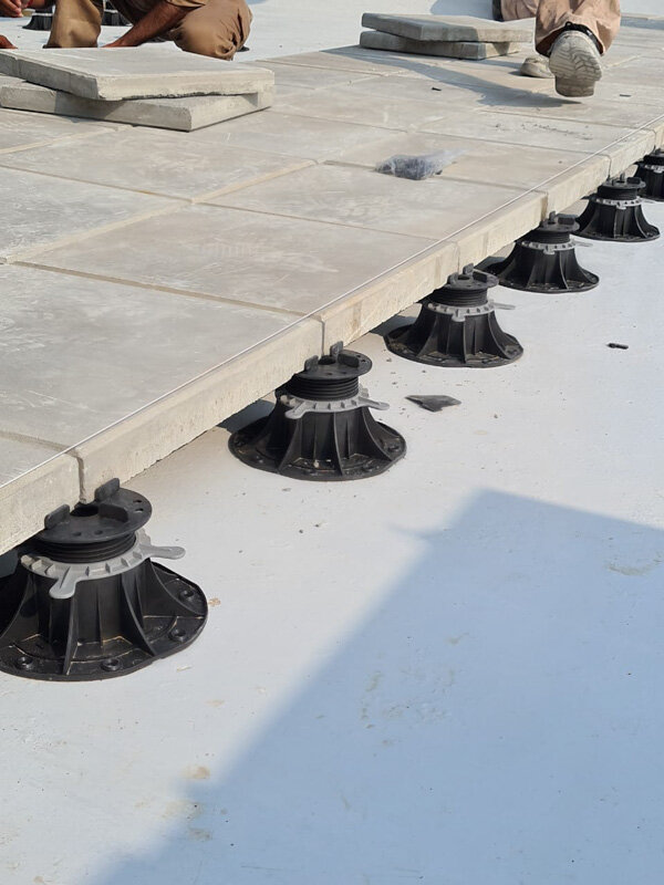 Terrace pedestals solver under light concrete terrace pavers substructure