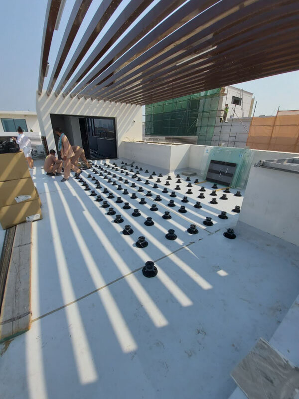 Laid terrace pedestals ready for laying concrete pavers