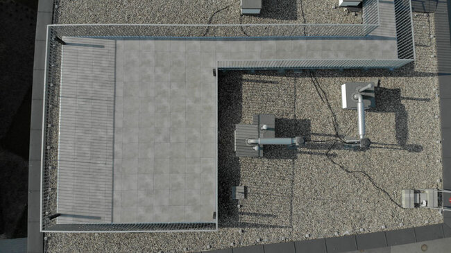 Aerial view of a terrace on a usable flat roof with gres tiles on pedestals