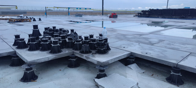 Standard pedestals on concrete pavers on a flat usable roof