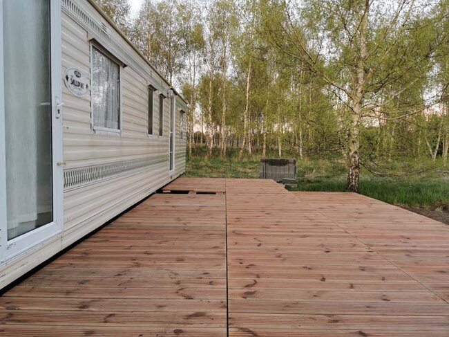 Terrace by the trailer made of natural wood on terrace pedestals max