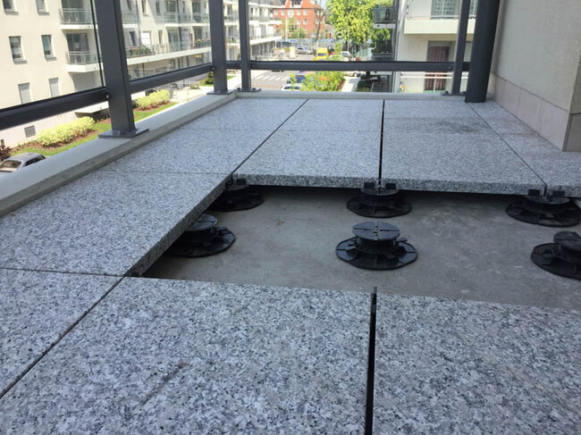 Adjustable pedestals standard for porcelain tiles on a balcony