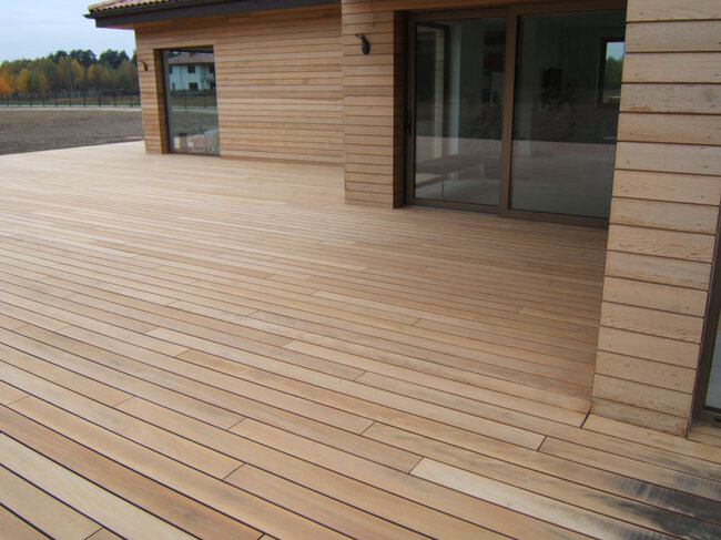 Wooden terrace on solver pedestals with joists and boards