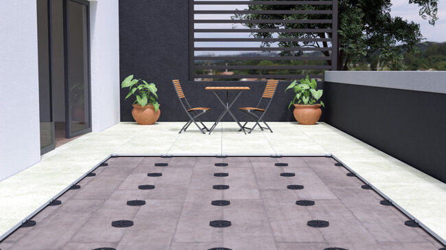 Laying pavers on support pads illustration