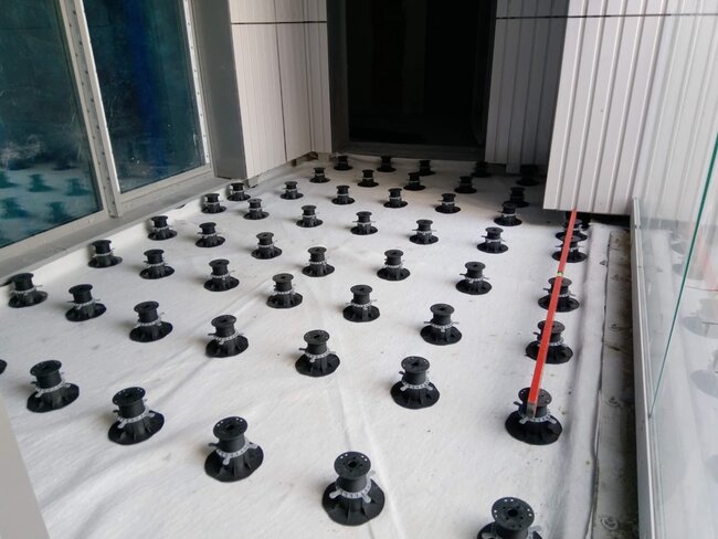 Laid pedestals ready for joist installation