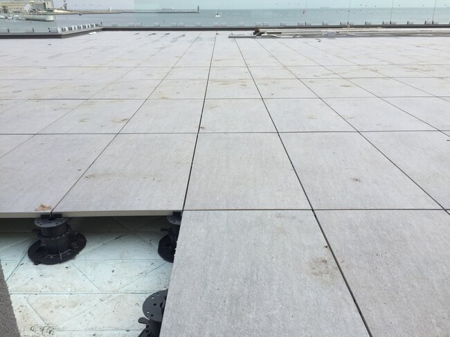 Elevated terrace in a seaside town made of terrace pavers laid on adjustable pedestals
