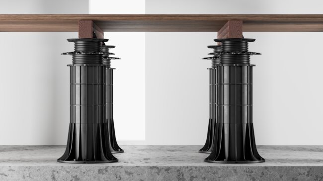 View of adjustable pedestals max under a wooden terrace with joists