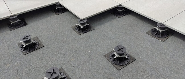Adjustable pedestals with SBR rubber pads for terrace pavers