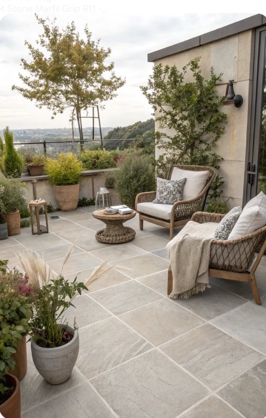 Garden arbor paved with large-format gres tiles.