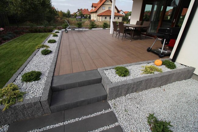 Installation of terrace pavers on adjustable pedestals construction of a raised deck terrace