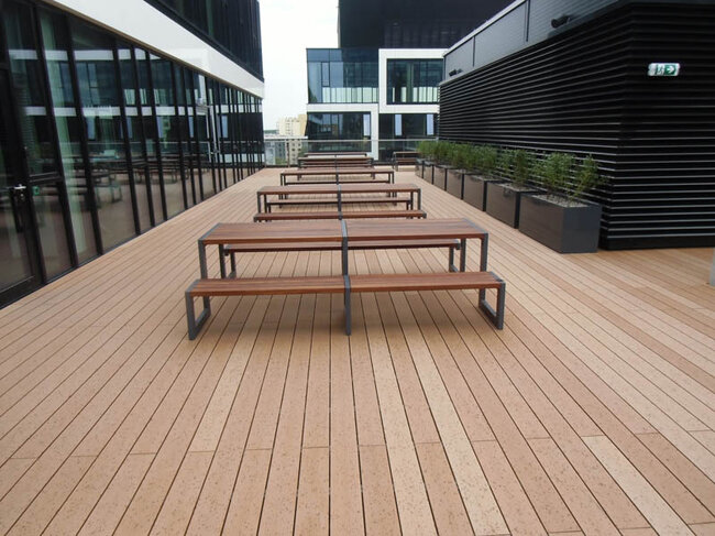 Viewing terrace on the roof with composite decking, benches, and vegetation