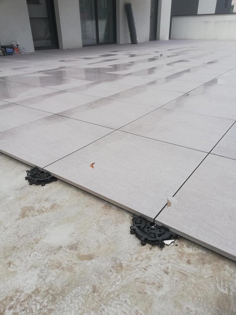 Ceramic pavers on adjustable Spiral-type pedestals