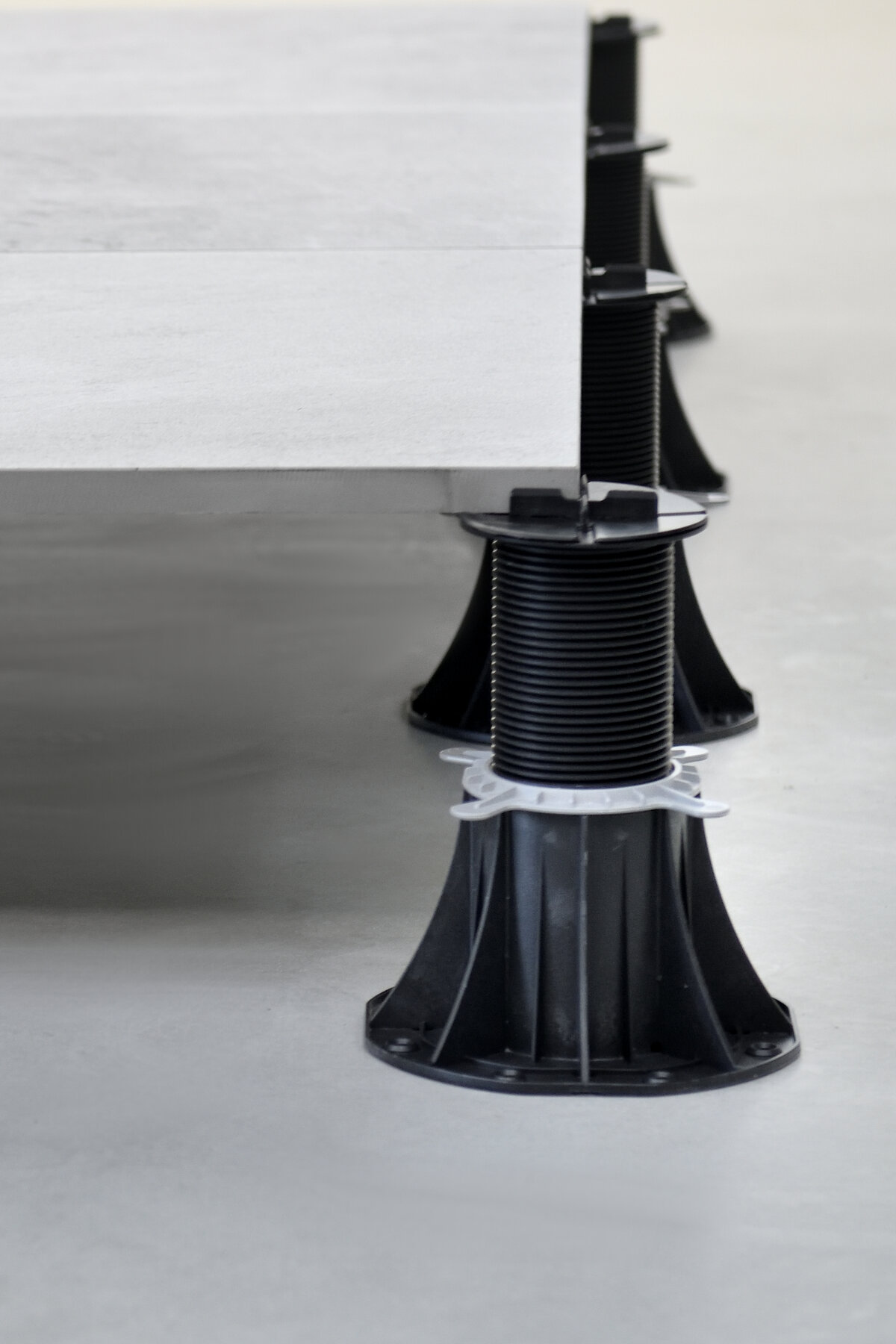 `System for mounting terrace pavers on adjustable supports`