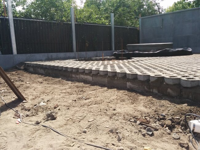Elevated substructure with lattice pavers prepared for terrace construction