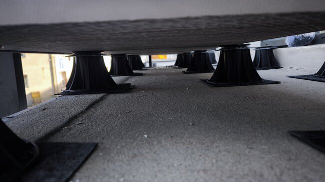 Bottom view of a raised deck terrace and adjustable pedestals