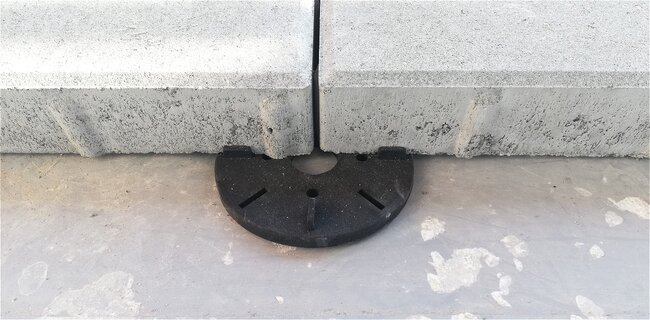 Concrete tiles laid on black terrace pedestals