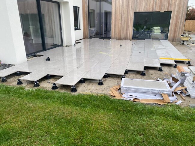 Construction of a raised deck terrace on adjustable pedestals