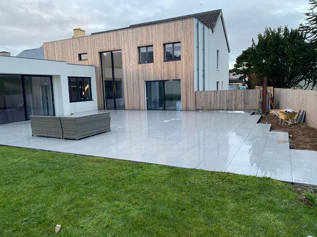 Elevated terrace with light gray porcelain pavers in the garden IMG