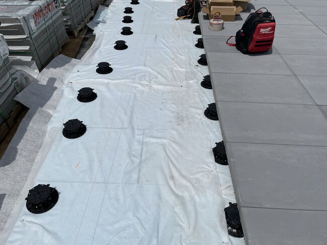 Preparation of the substrate and adjustable pedestals for the installation of terrace pavers