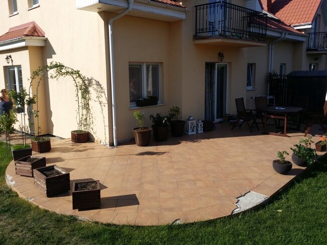 Damaged terrace with ceramic tiles requiring renovation