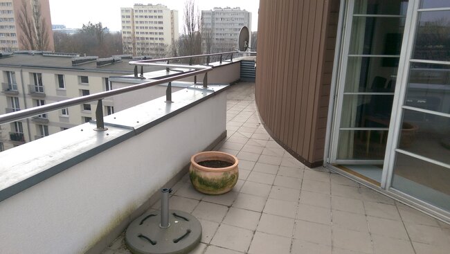 Elevated terrace with ceramic pavers on adjustable pedestals