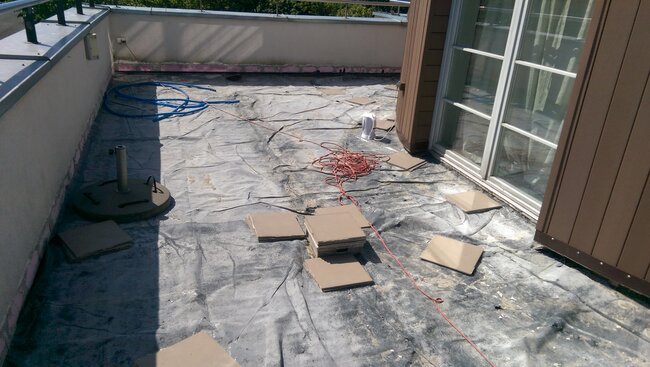 Removal of old terrace pavers and preparation of the substrate with waterproofing