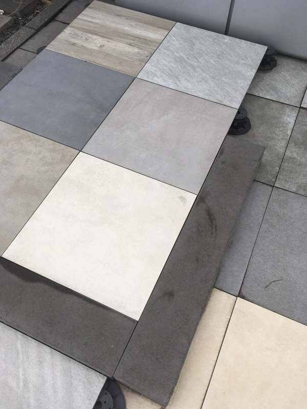 Diverse porcelain terrace pavers laid on adjustable pedestals