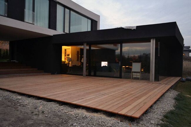 Large wooden terrace at a modern single-family house