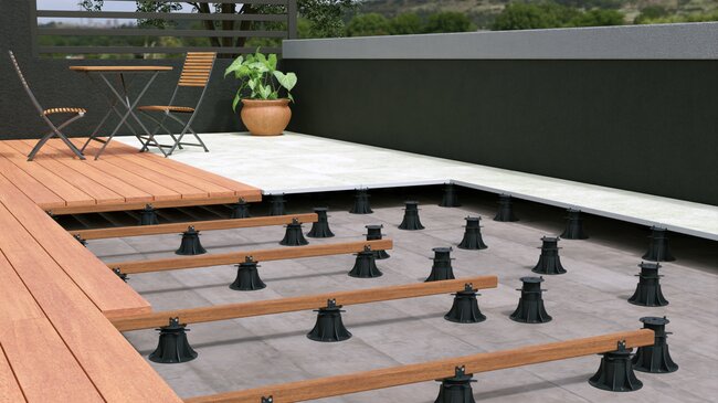 *Cross-section of a raised deck terrace with water drainage over the waterproofing layer.