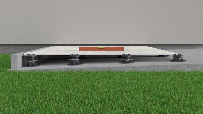 Visualization showing a cross-section of a raised deck terrace that shows how the pedestals level out the slopes that are on the substrate beneath the terrace.