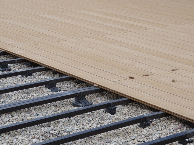 Photo of a raised deck terrace made of exotic hardwood boards.