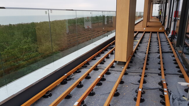 Photo of a raised deck terrace on a roof using terrace boards on joists