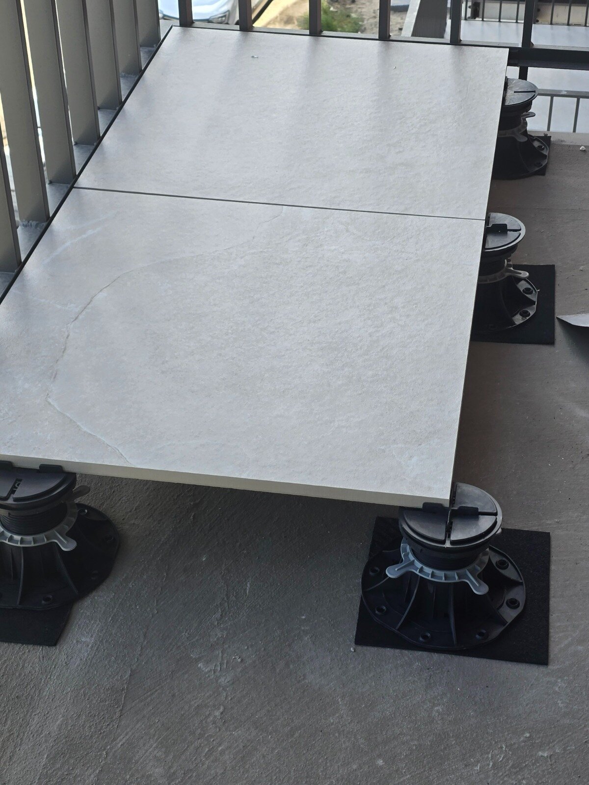 3 mm expansion joints between gres tiles on a raised deck terrace on adjustable solver pedestals