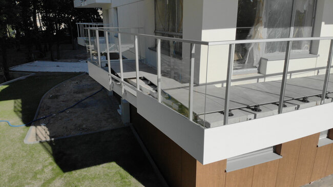 Raised deck terrace with pavers on adjustable pedestals - standard for large-scale projects