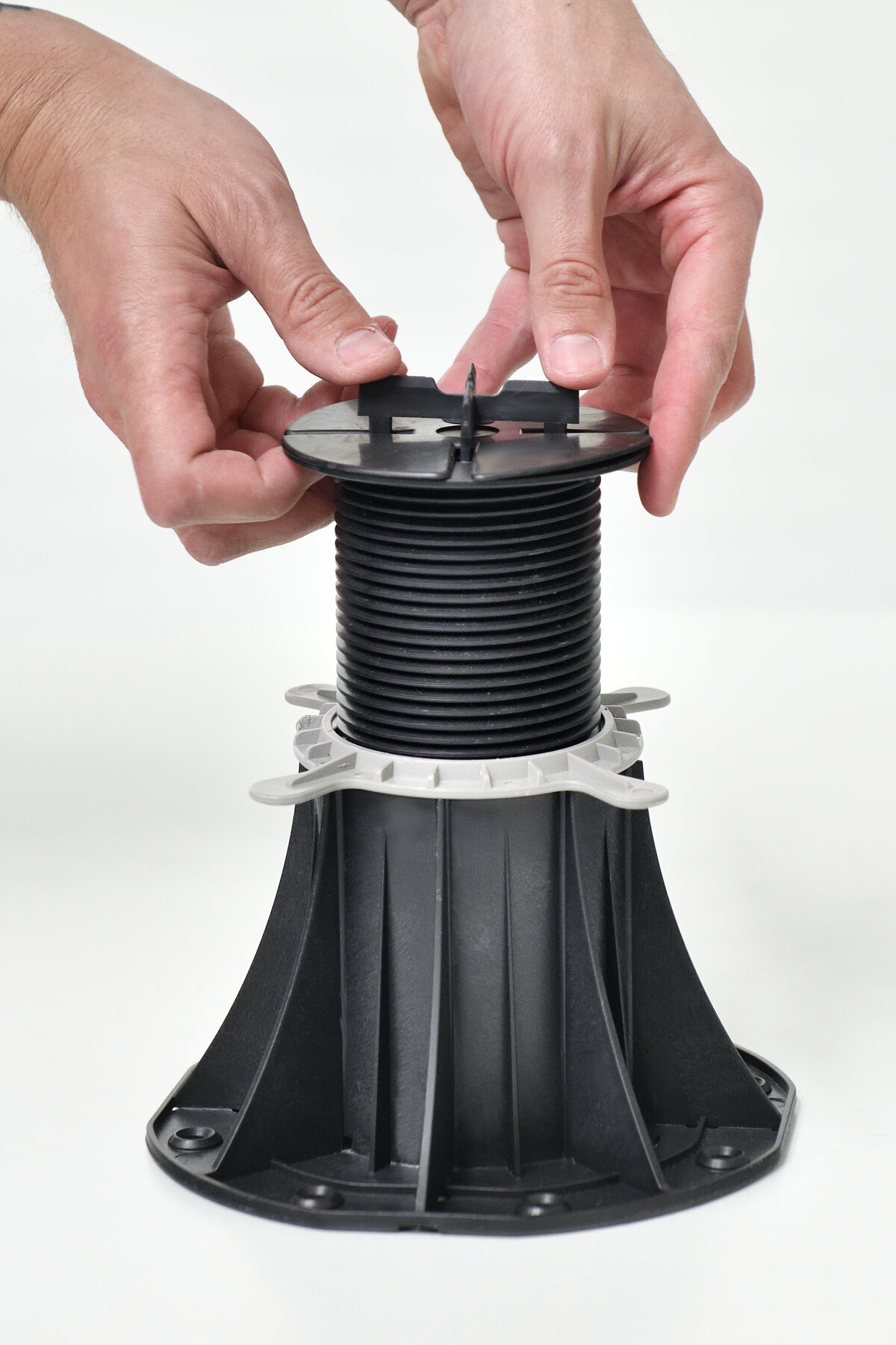 Mounting spacers on the adjustable pedestal