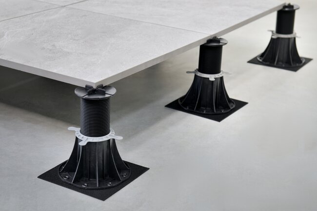 Mounting the joist adapter on the adjustable terrace pedestal