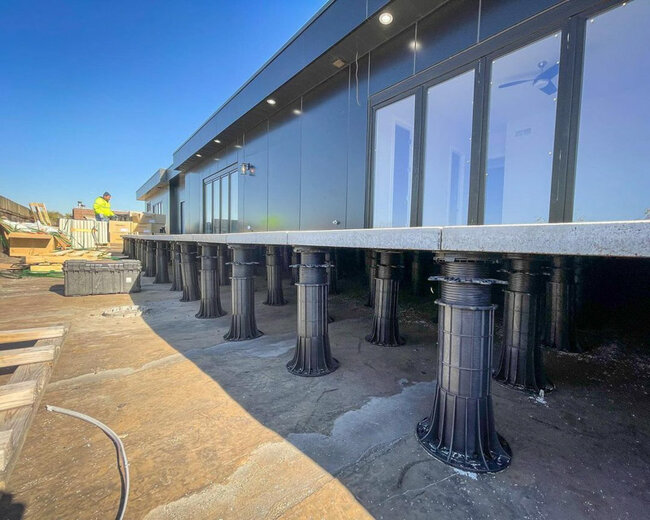 High terrace pedestals forming the structure of a raised deck terrace on the ground
