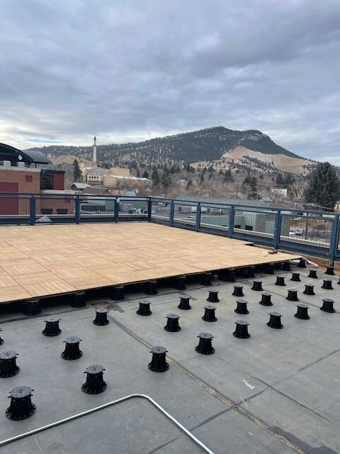 Terrace on a tall building with terrace pedestals and composite pavers