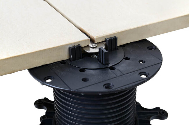 Pedestal with wind protection for paver mounted to a cut paver