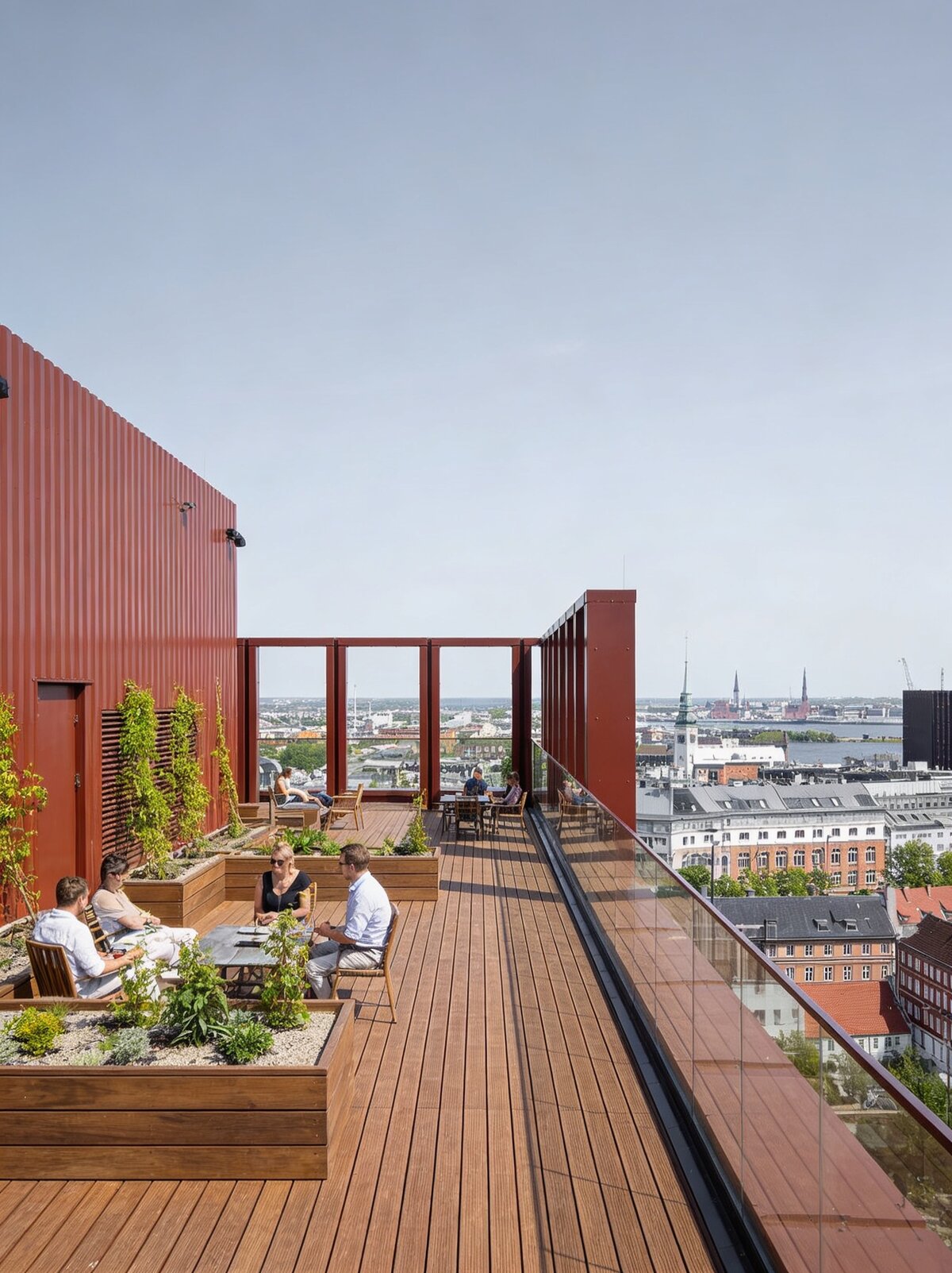 Elevated terrace on pedestals on a skyscraper roof with planters
