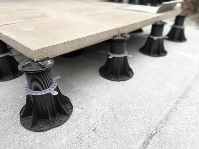 Terrace with thick concrete paver on standard adjustable pedestals