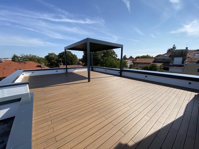 Roof terrace made of composite with pergola roof.