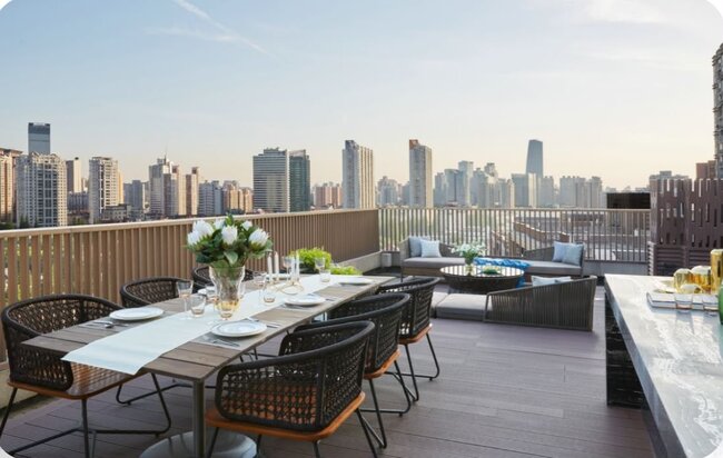 Modern rooftop terrace with a city view.